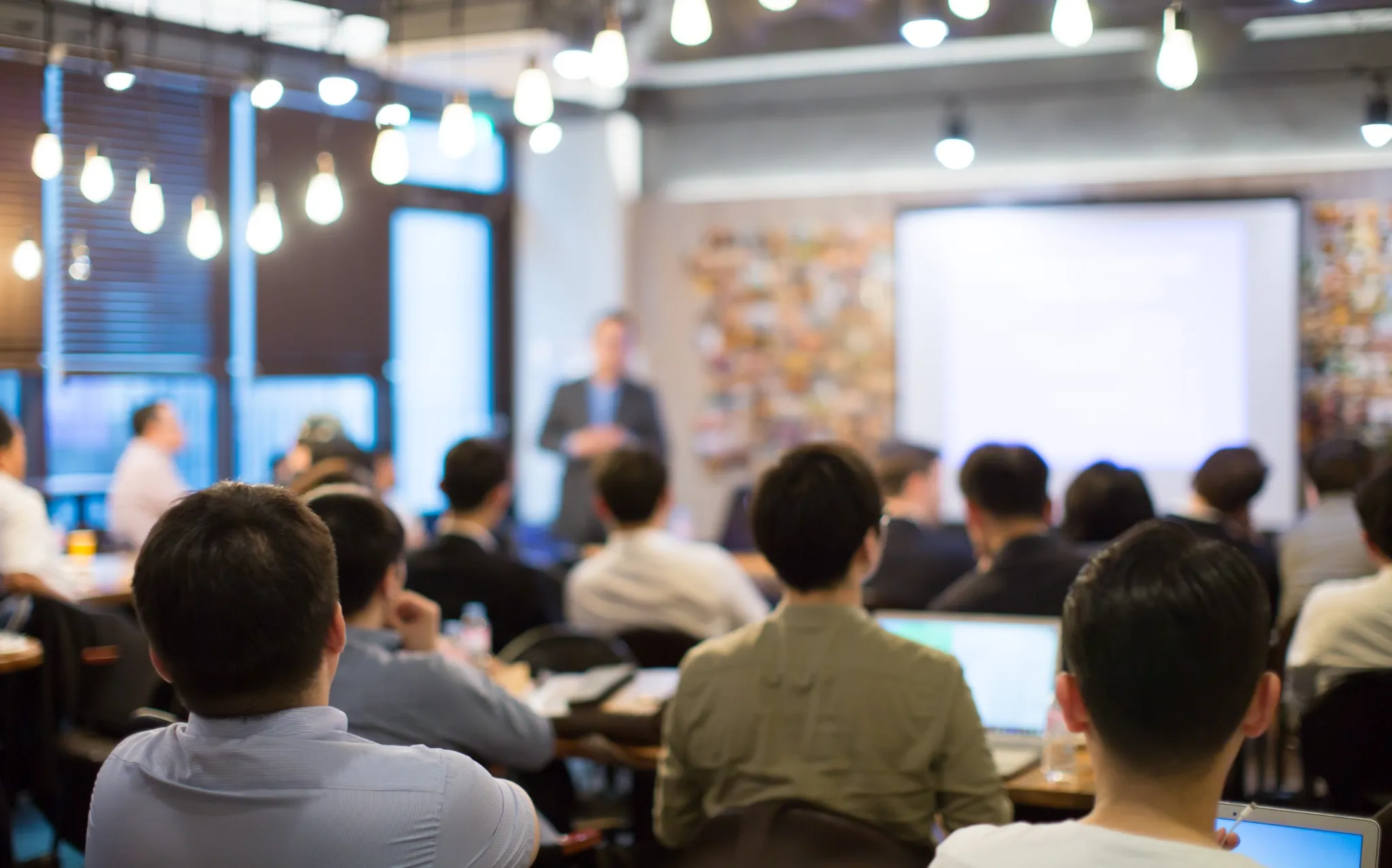 Technology Executive Speaks about Artificial Intelligence and Business Strategy. Speaker for Tech Startup Gives Presentation to Corporate Investors and Venture Funds During Seed Funding Round.