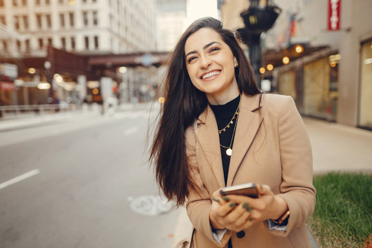 Smiling business woman in Chicago on phone