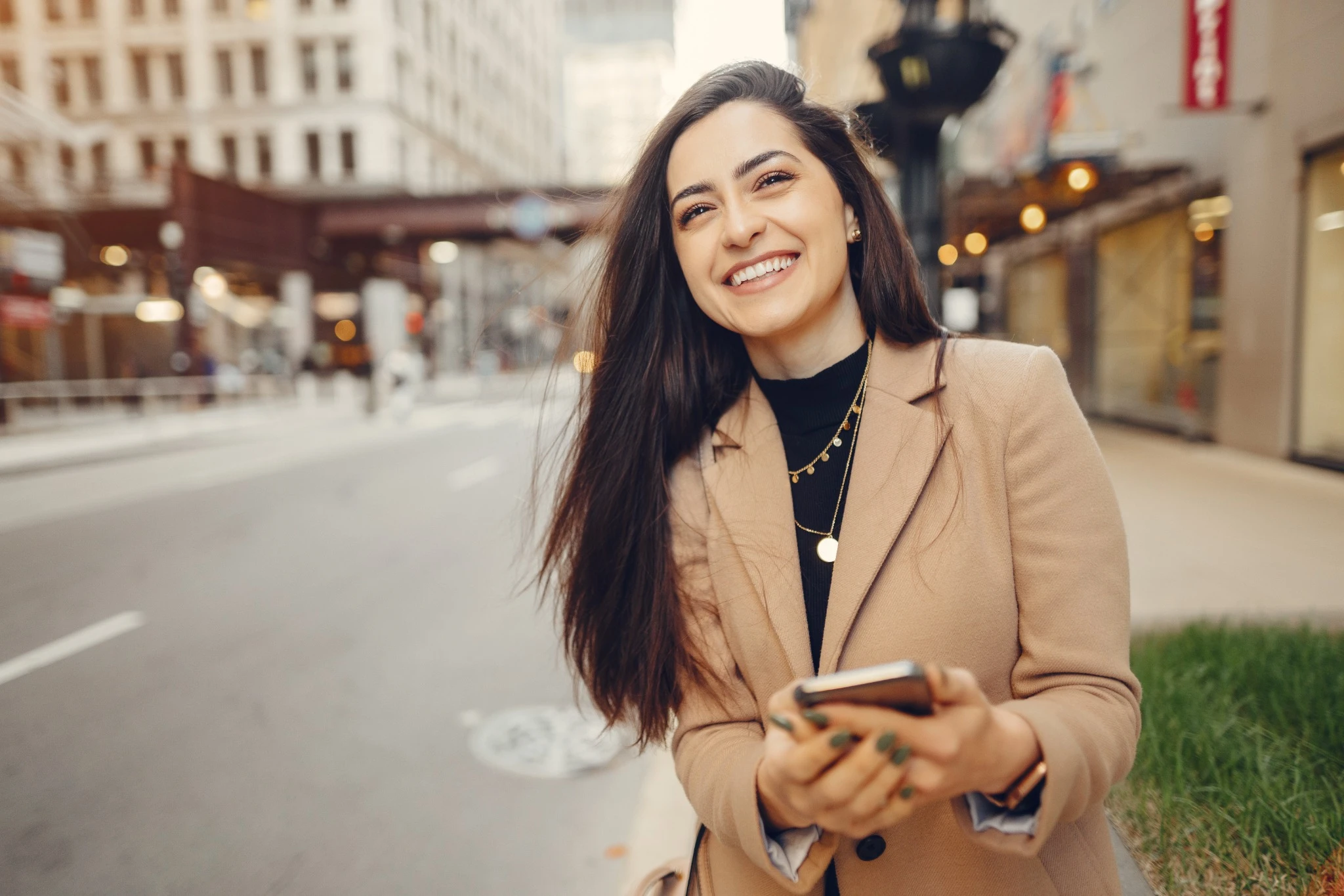 Smiling business woman in Chicago on phone