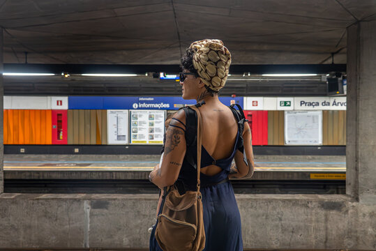 Tattoed women with a baby at a subway station