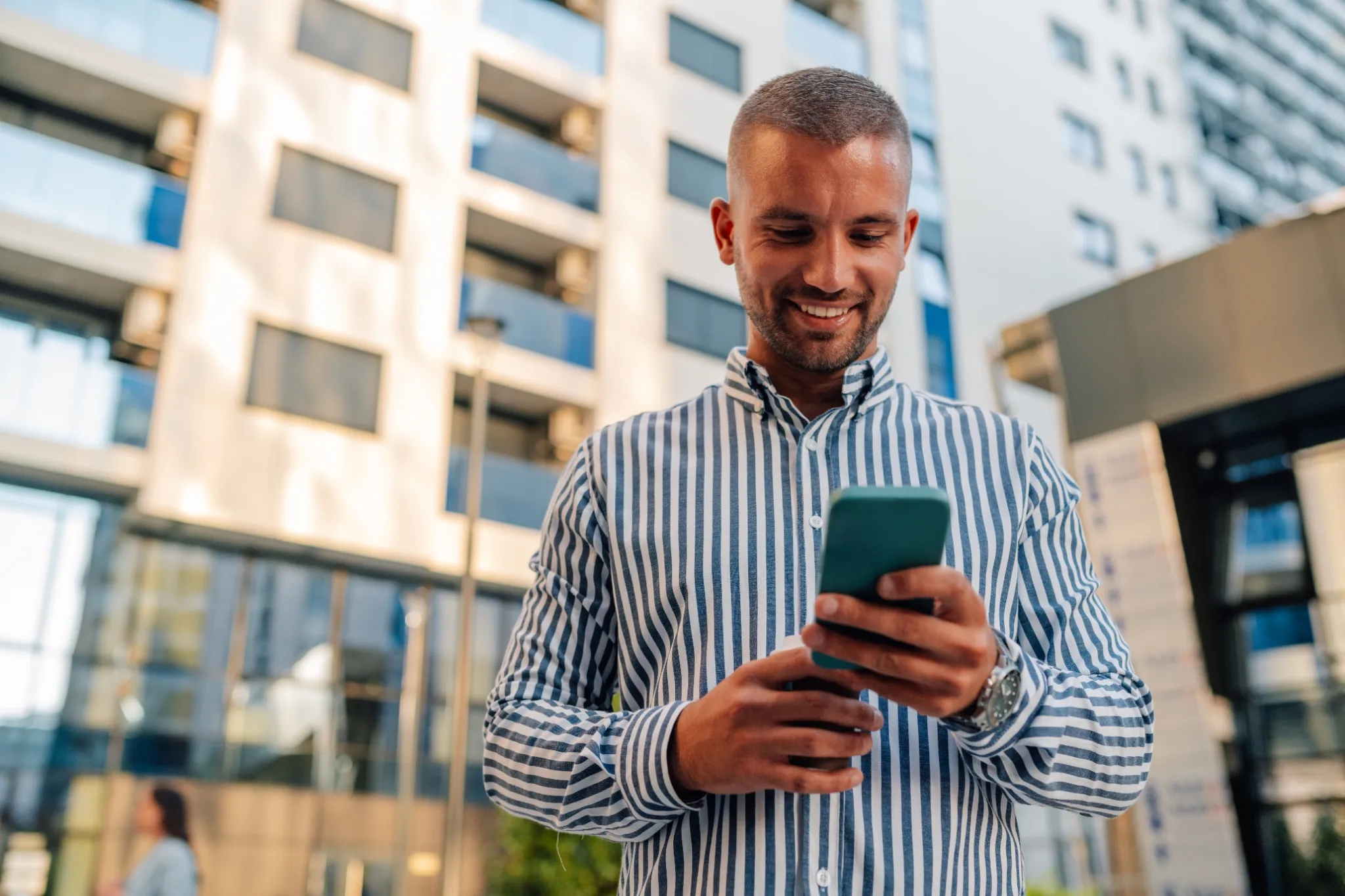 Img - man out walking properties on phone