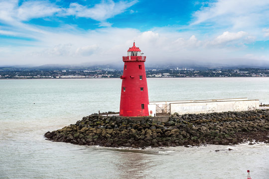 Red lighthouse during the day