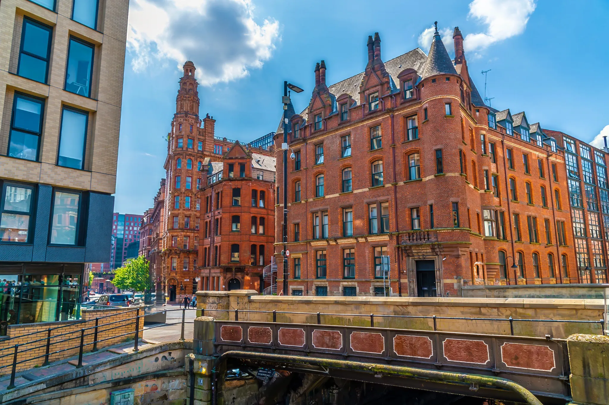 A view past a road bridge over canal street in Manchester,UK in summertime