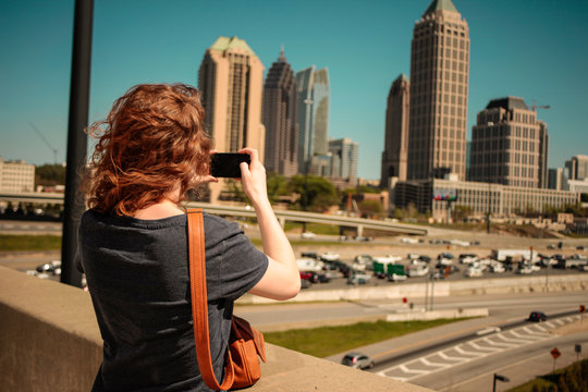 Woman taking photos of Atlanta