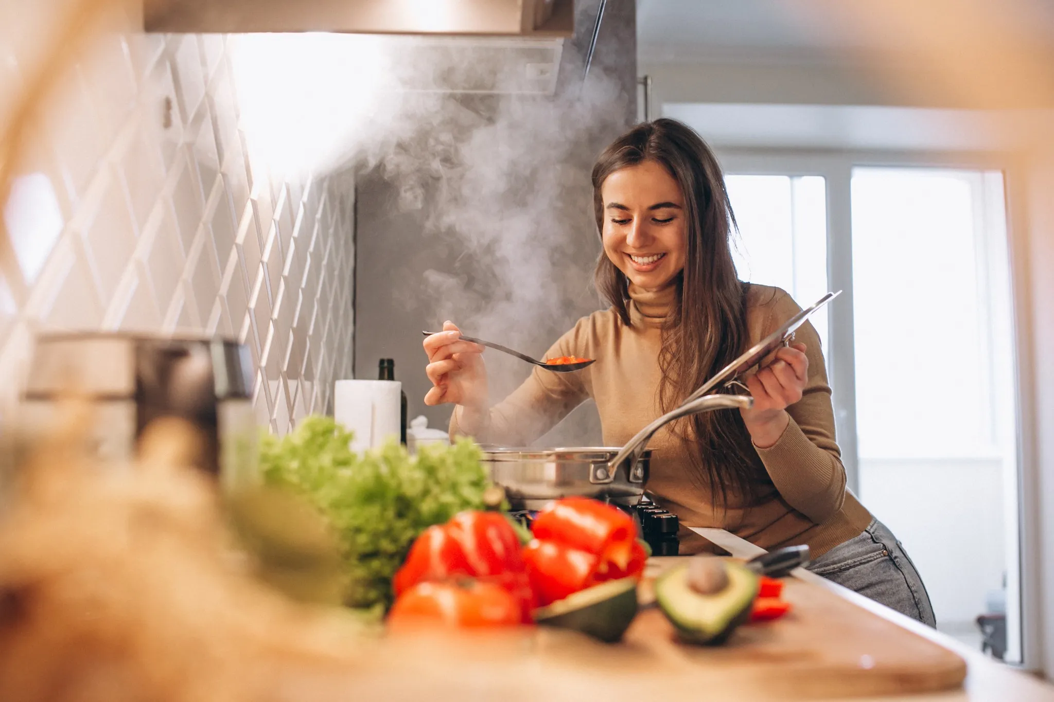 Young woman cooking at home