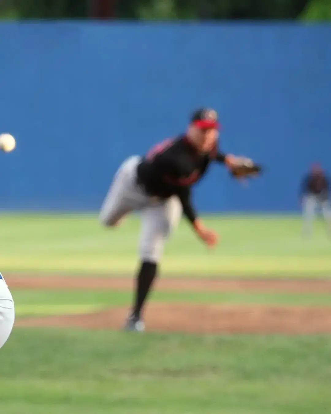 batter watching ball that pitcher threw
