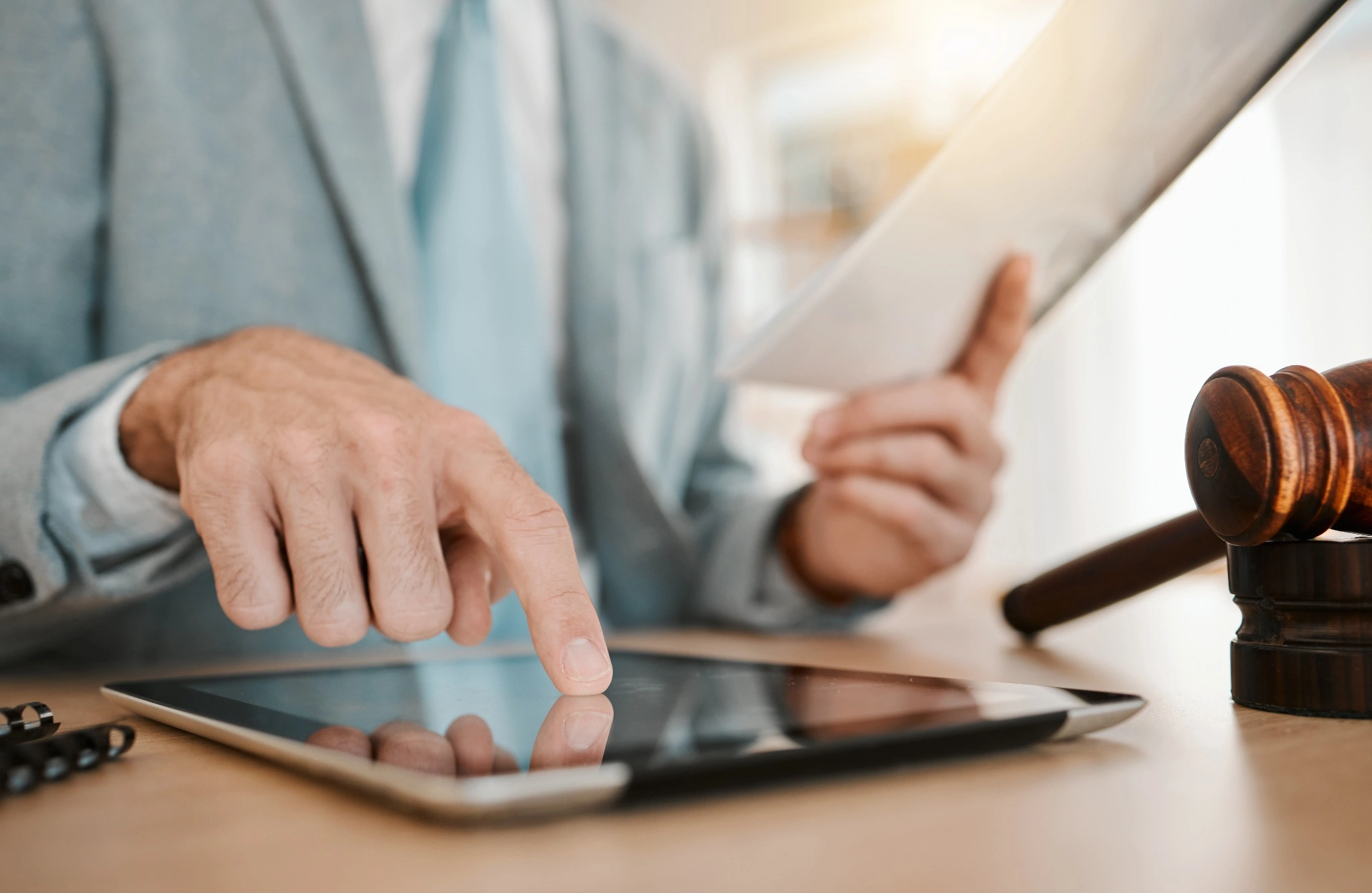 Man with hand on tablet