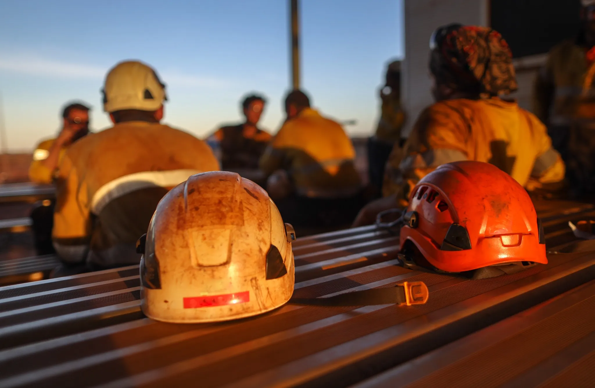 Red rope access miner safety helmet head protection place on the table mine site Perth, Australia