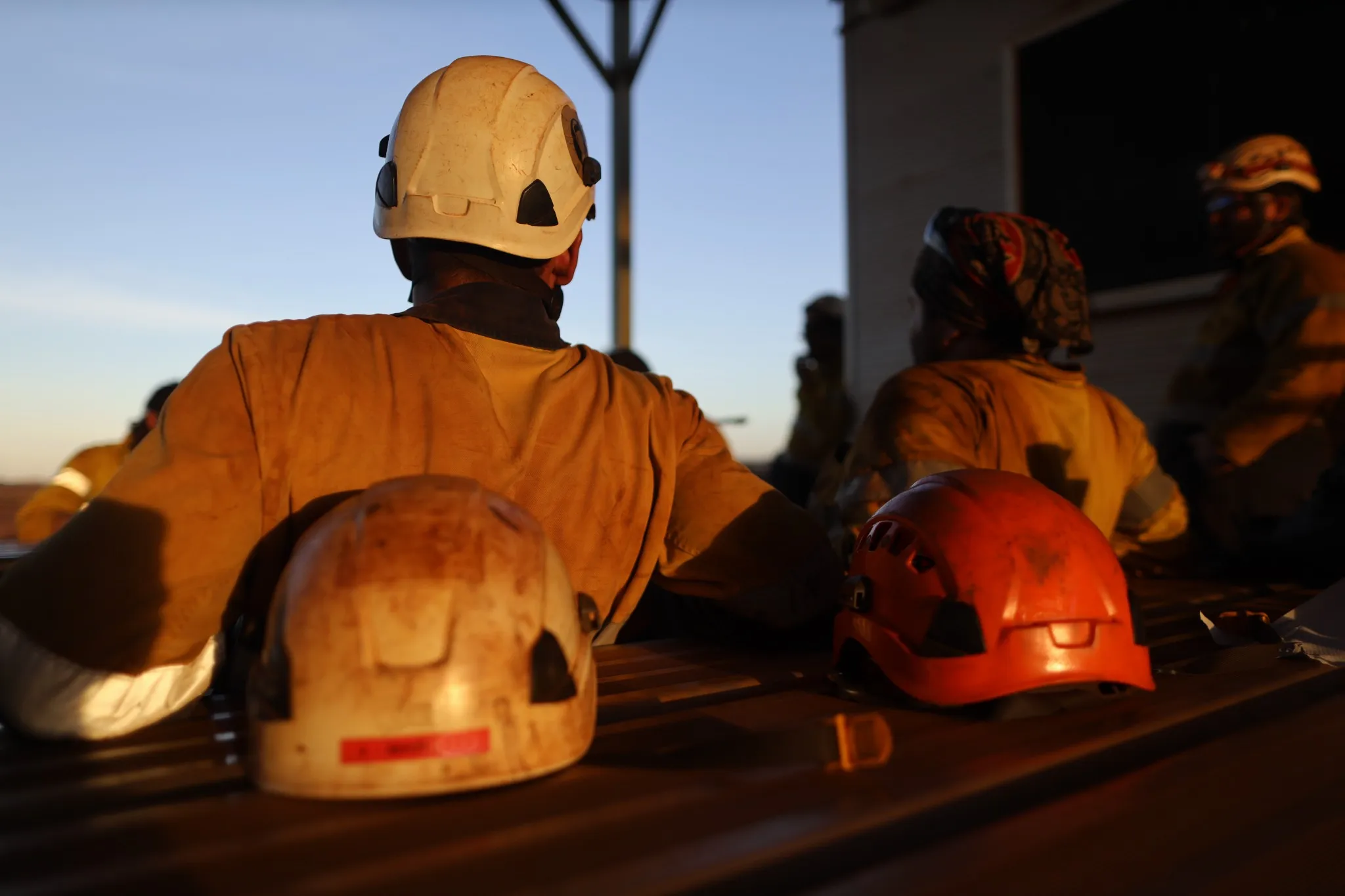 Red rope access miner safety helmet head protection place on the table mine site Perth, Australia