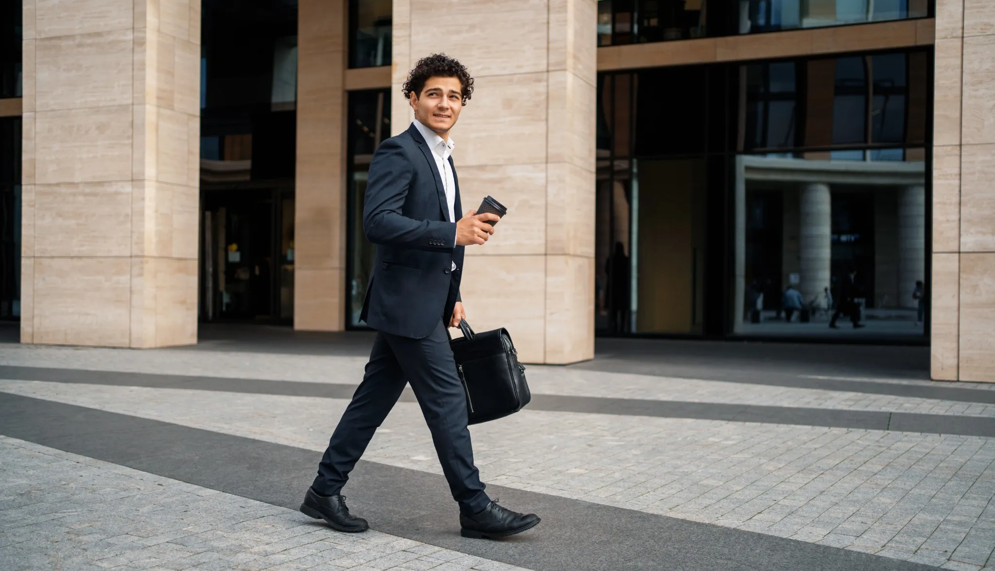 man in suit walking to work