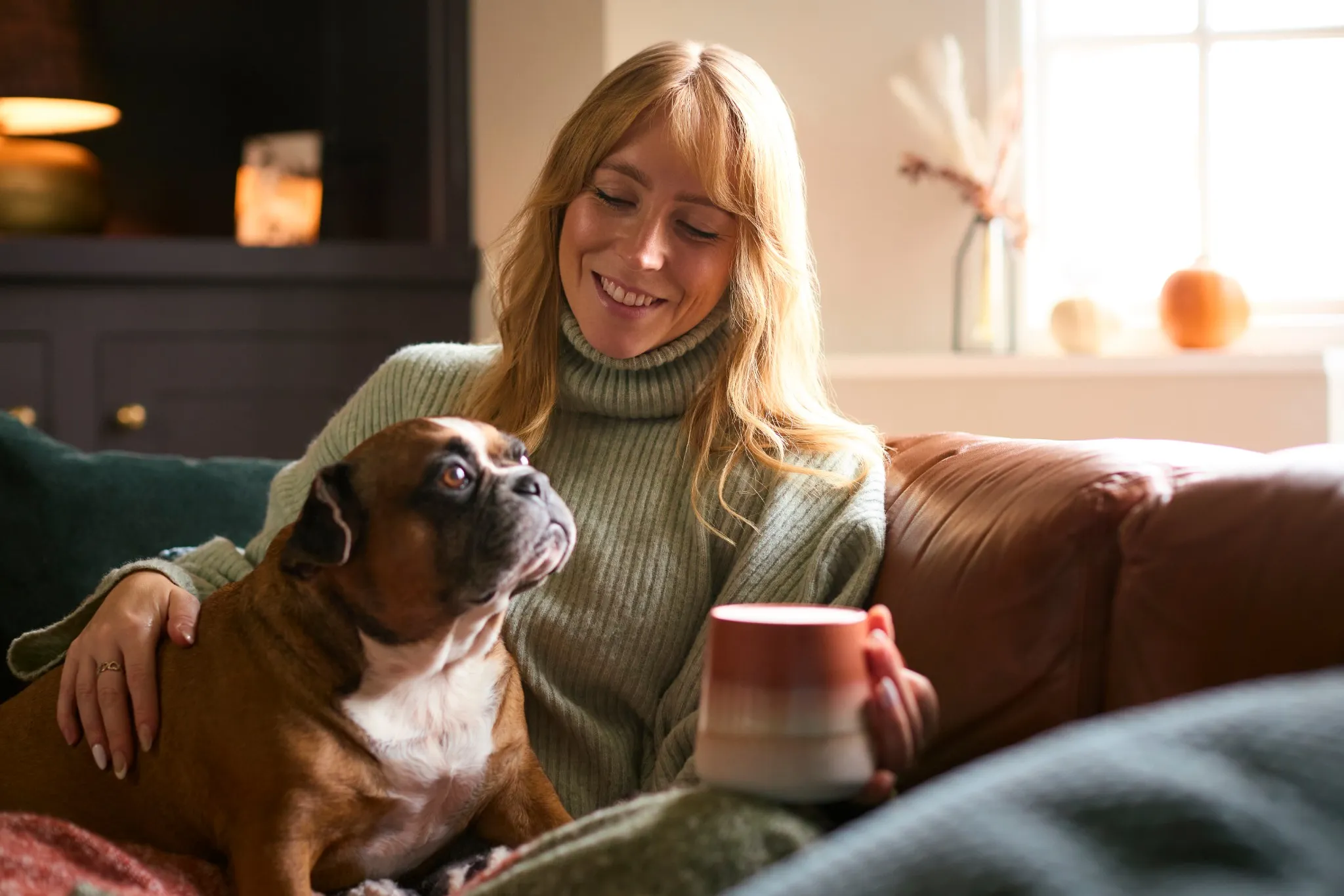 Woman with her dog on the couch