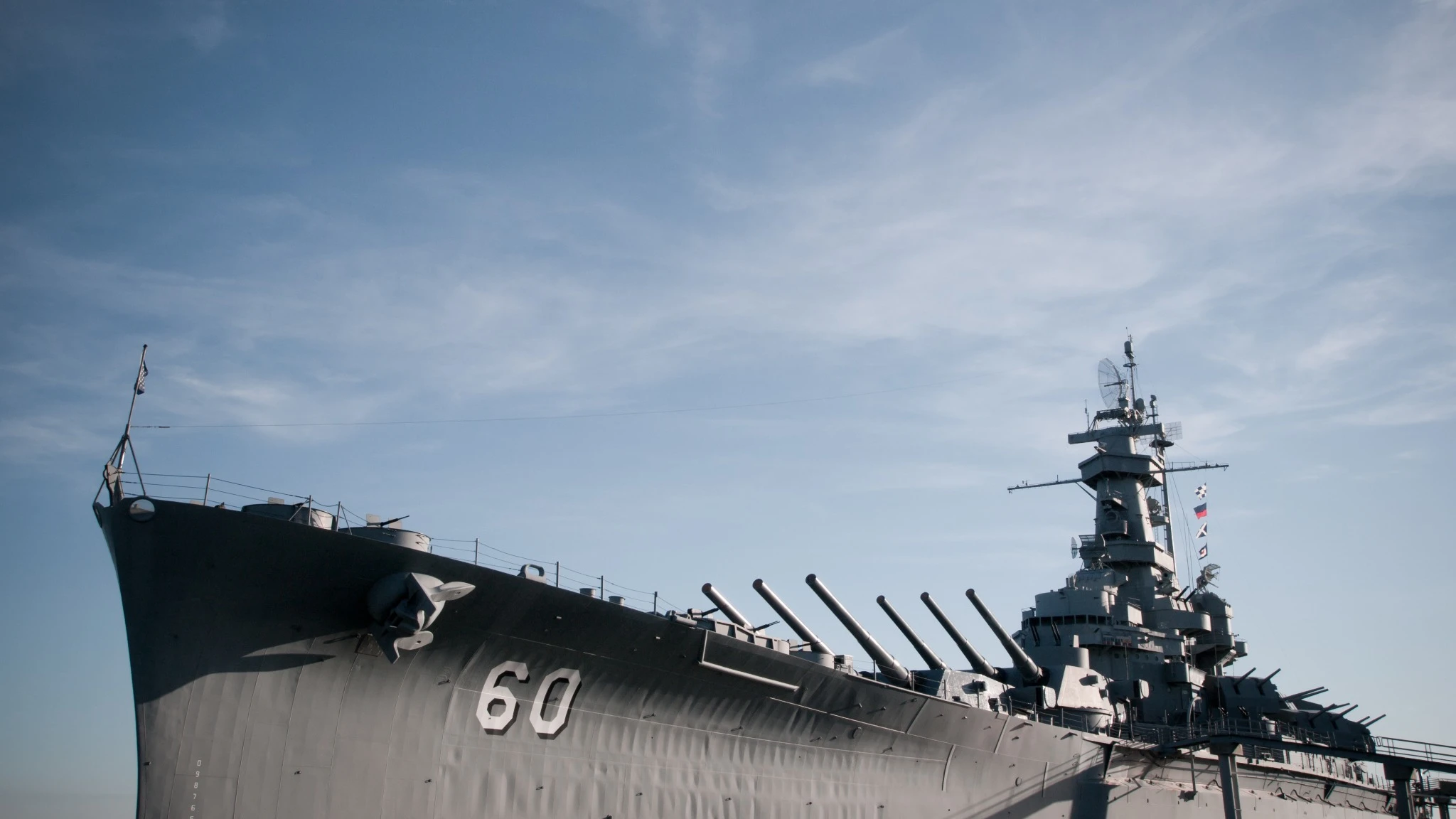 US Navy ship with blue sky backdrop
