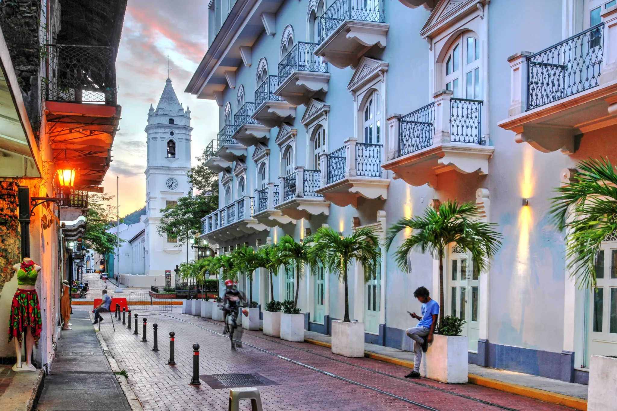 Avenida Central in Casco Viejo, Panama with Santa Maria La Antigua - Metropolitan Cathedral - in the background at sunset.