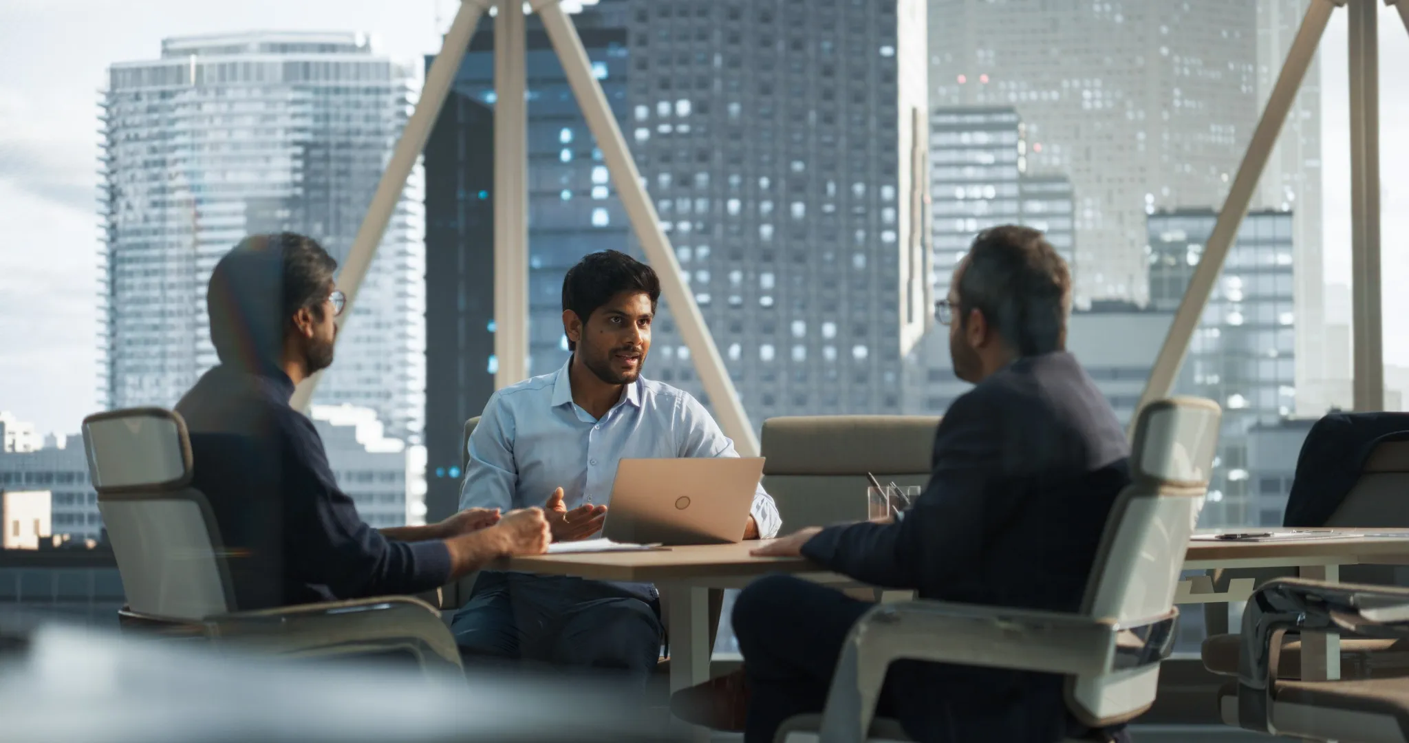 Three Young South Asian Colleagues Working in a Business Software Development Company.jpg