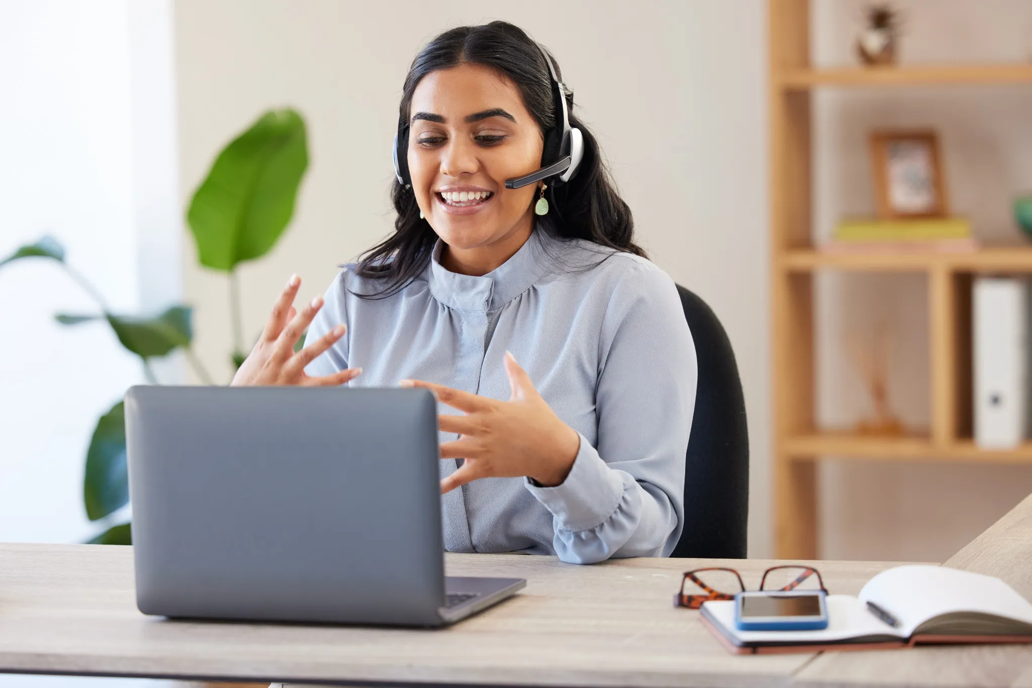 woman working at home with headset