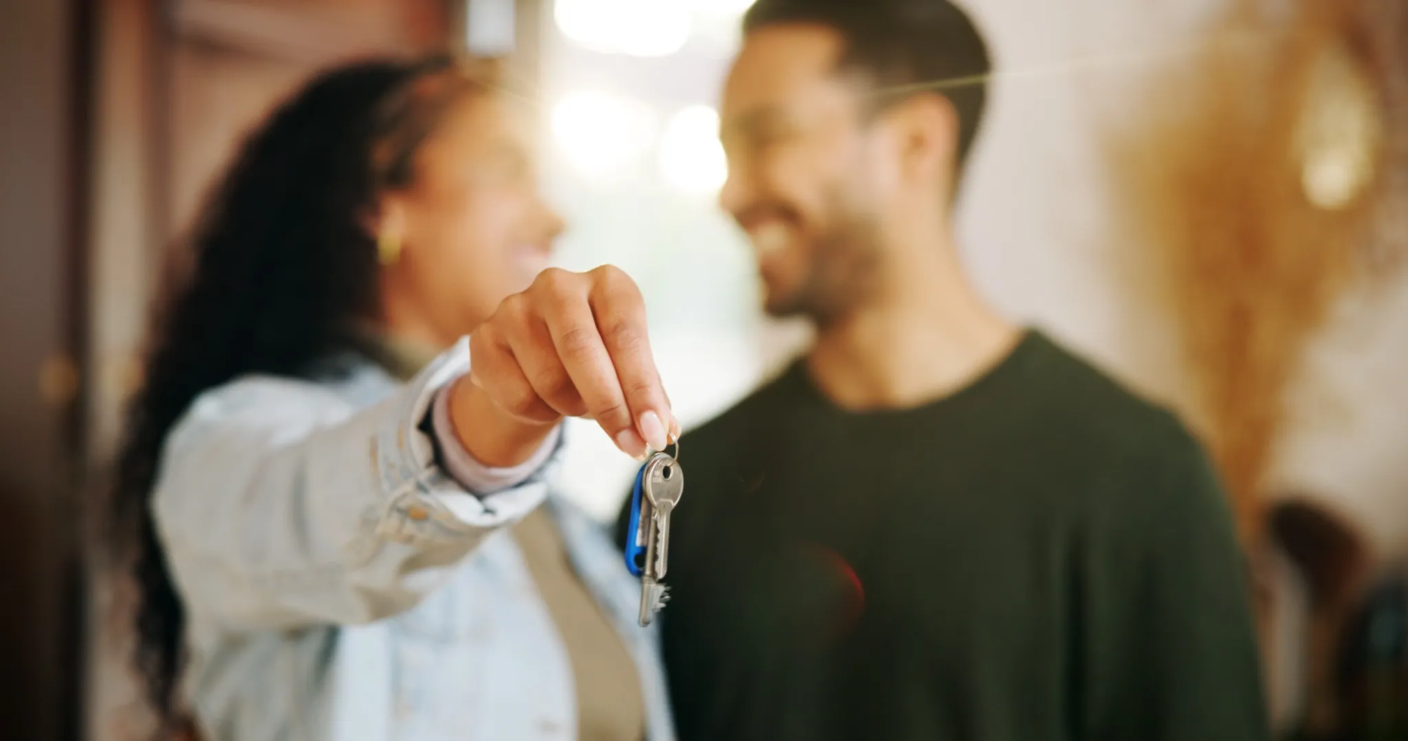 Couple, hand and keys with new home, moving in and finance investment together.