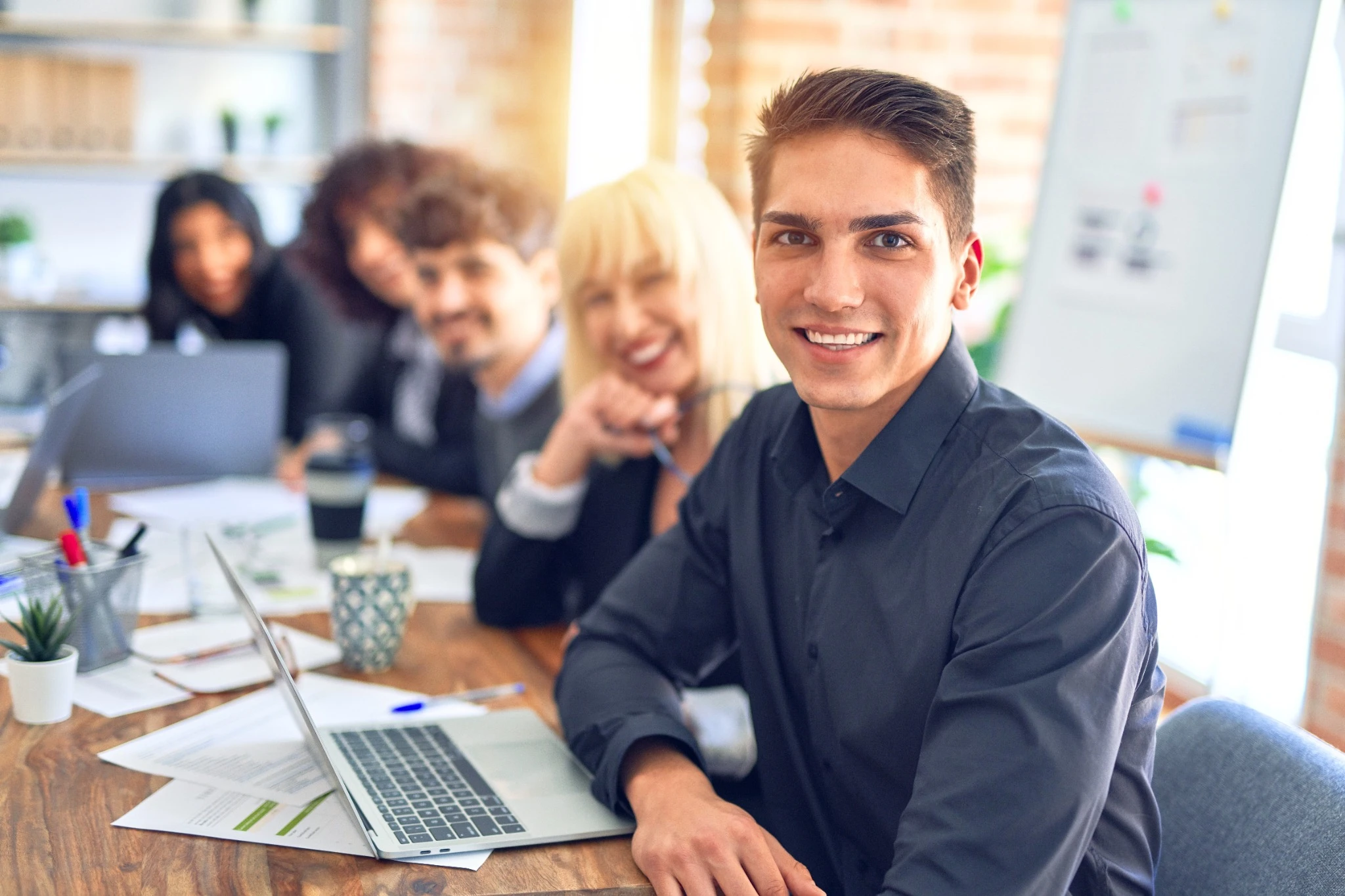 Smiling young man at work