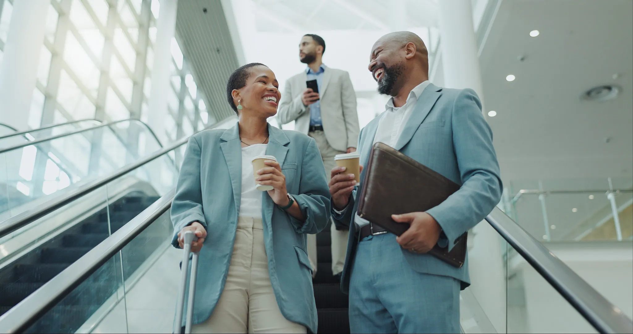 People on escalator at airport