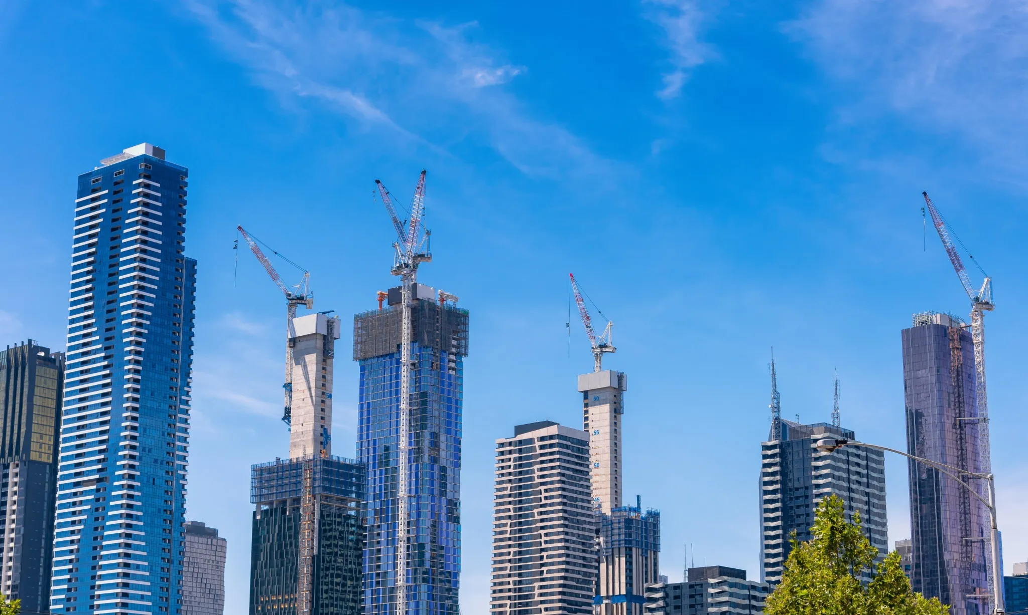 Melbourne skyscrapers and cranes city growing