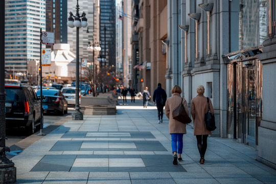 Women walking down the street downtown Chicago, IL
