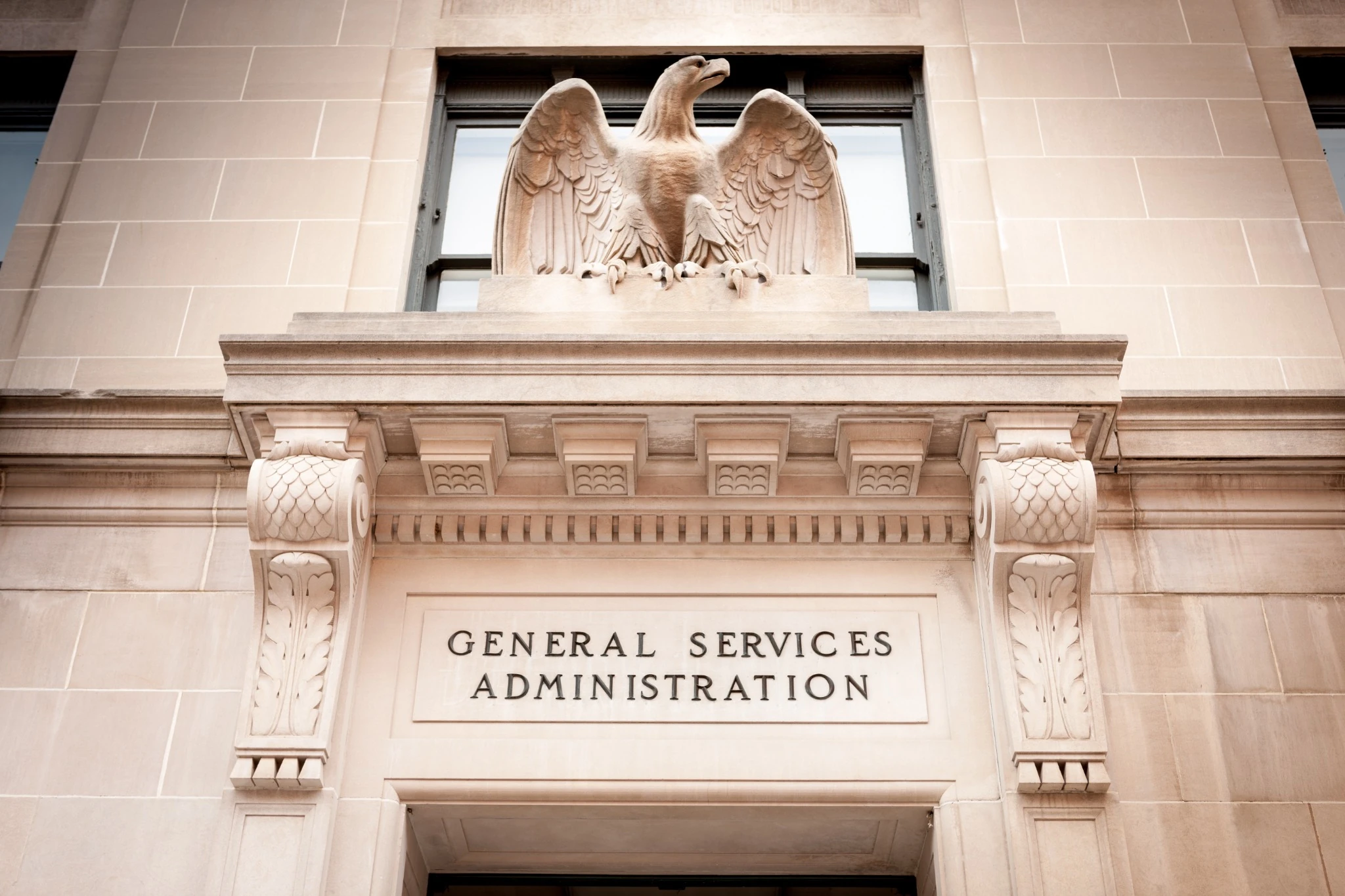 above the door of the GSA building showcasing stone eagle