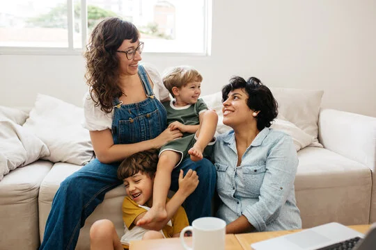 smiling family with two moms