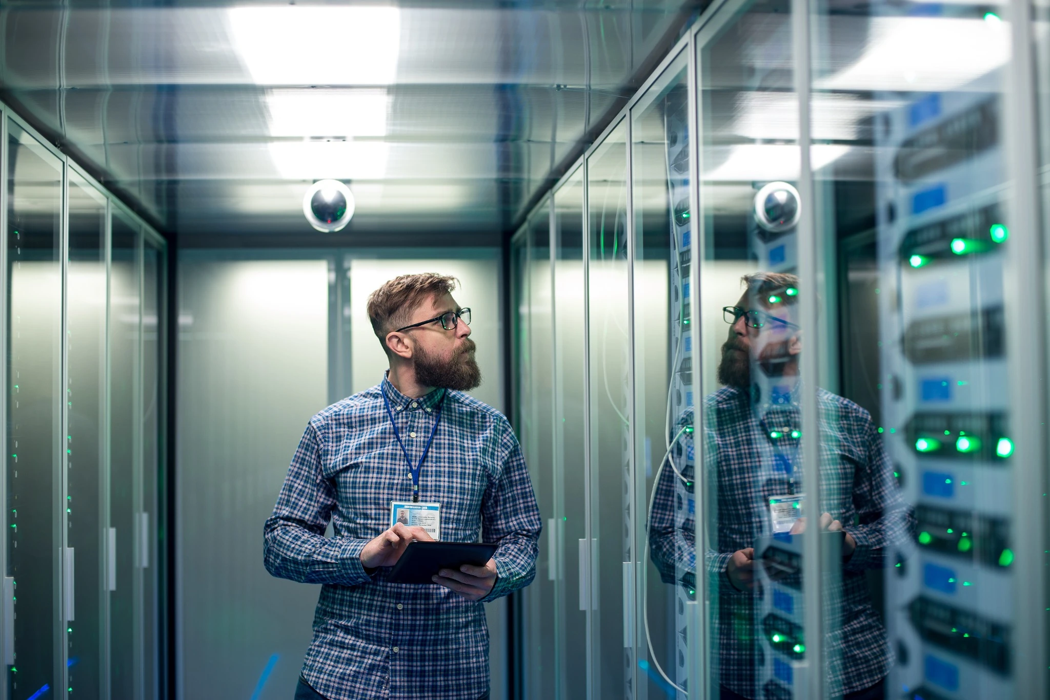 IT engineer with tablet in server room.