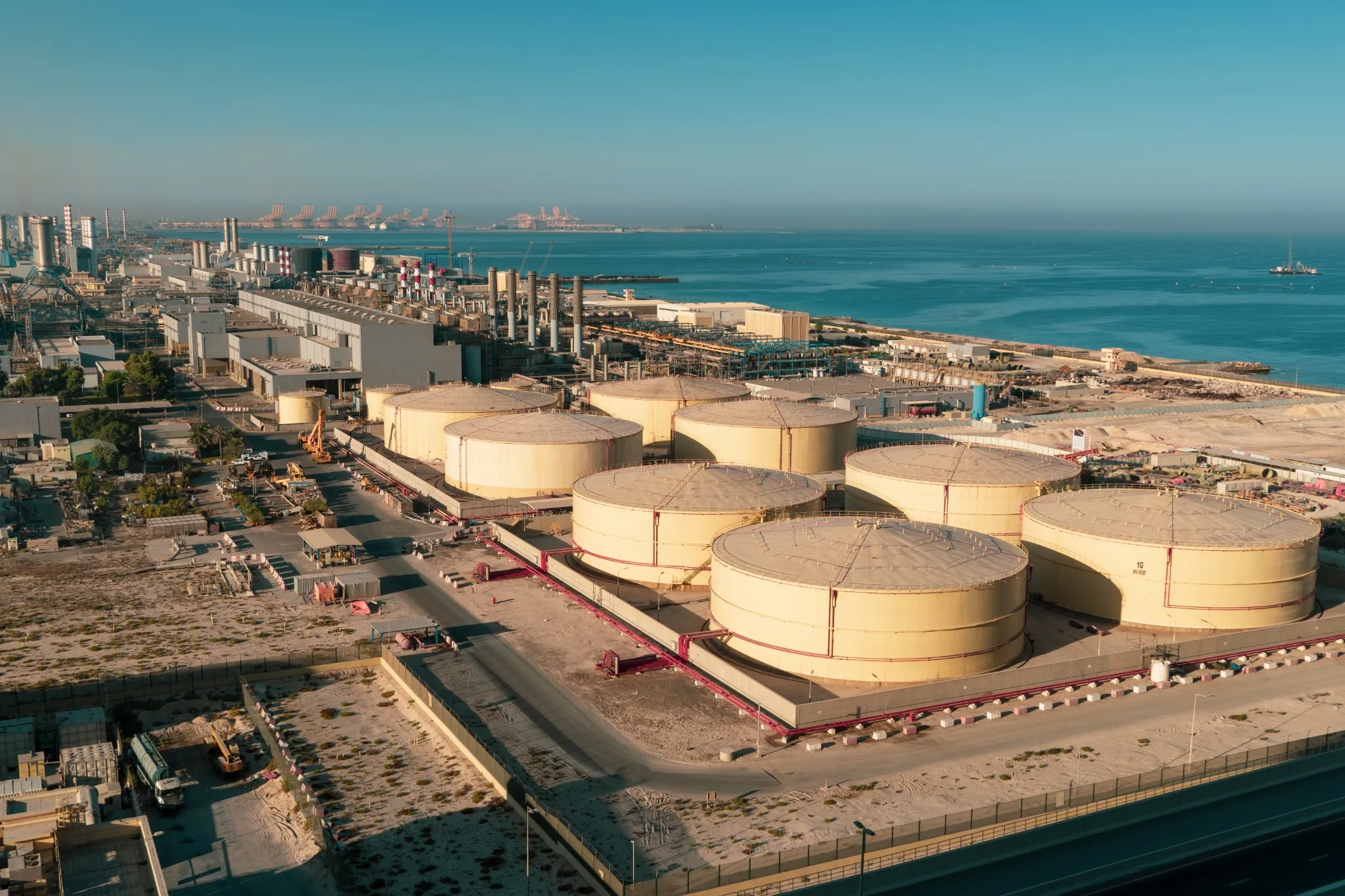 Middle East water and gas containers along the coastline for gas, water and oil concepts. Industrial zone.