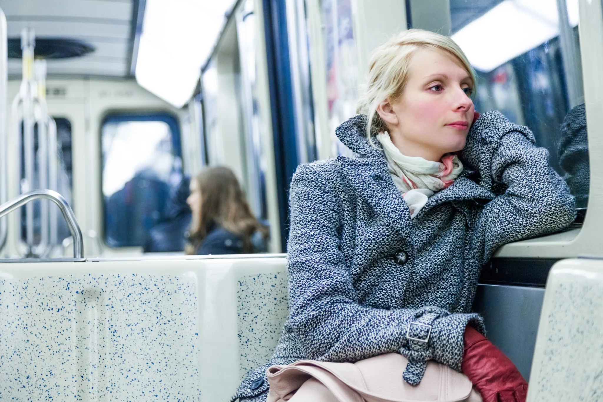 Young Woman Sitting inside a Metro Wagon.