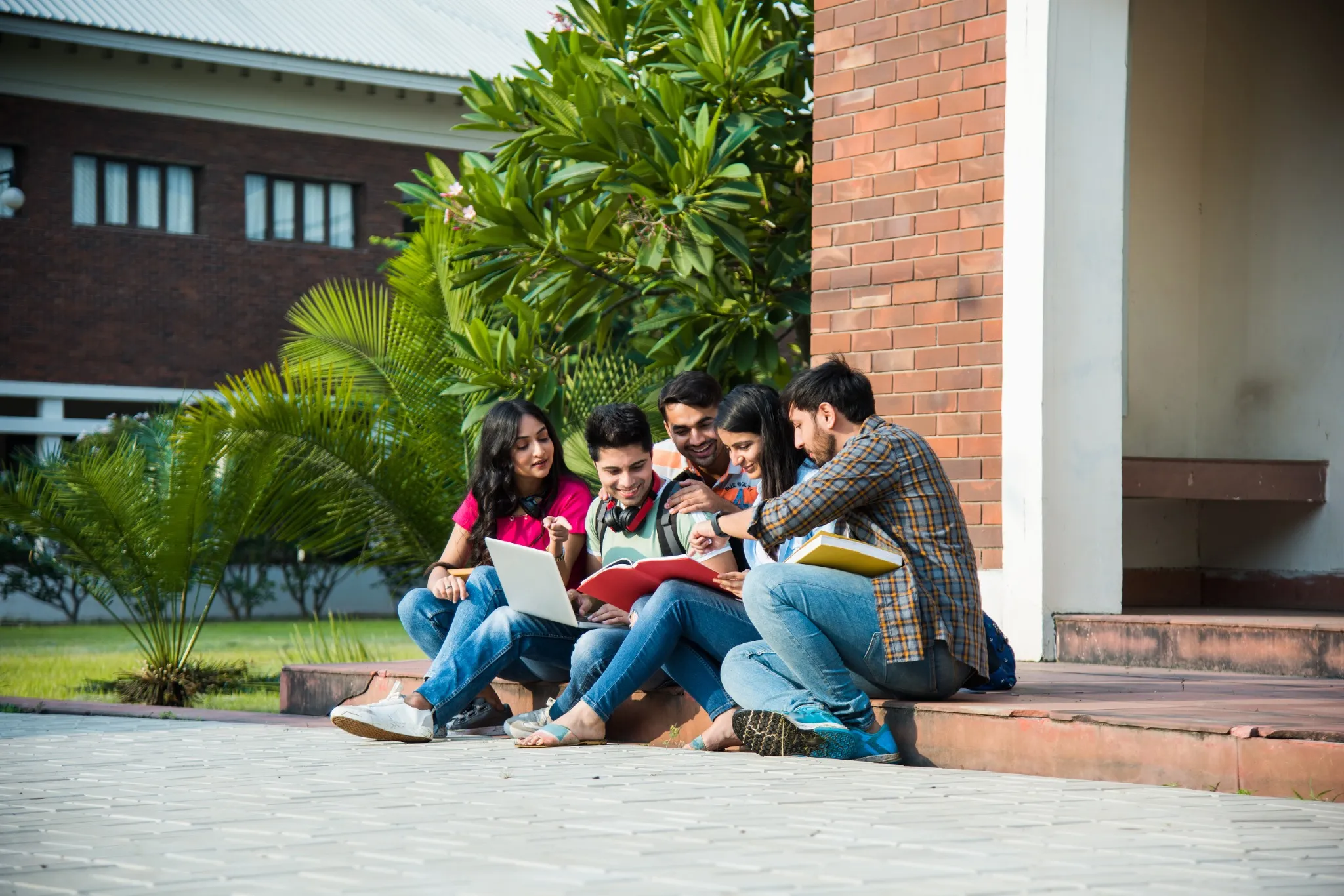 Asian Indian college students doing group study or working on project.