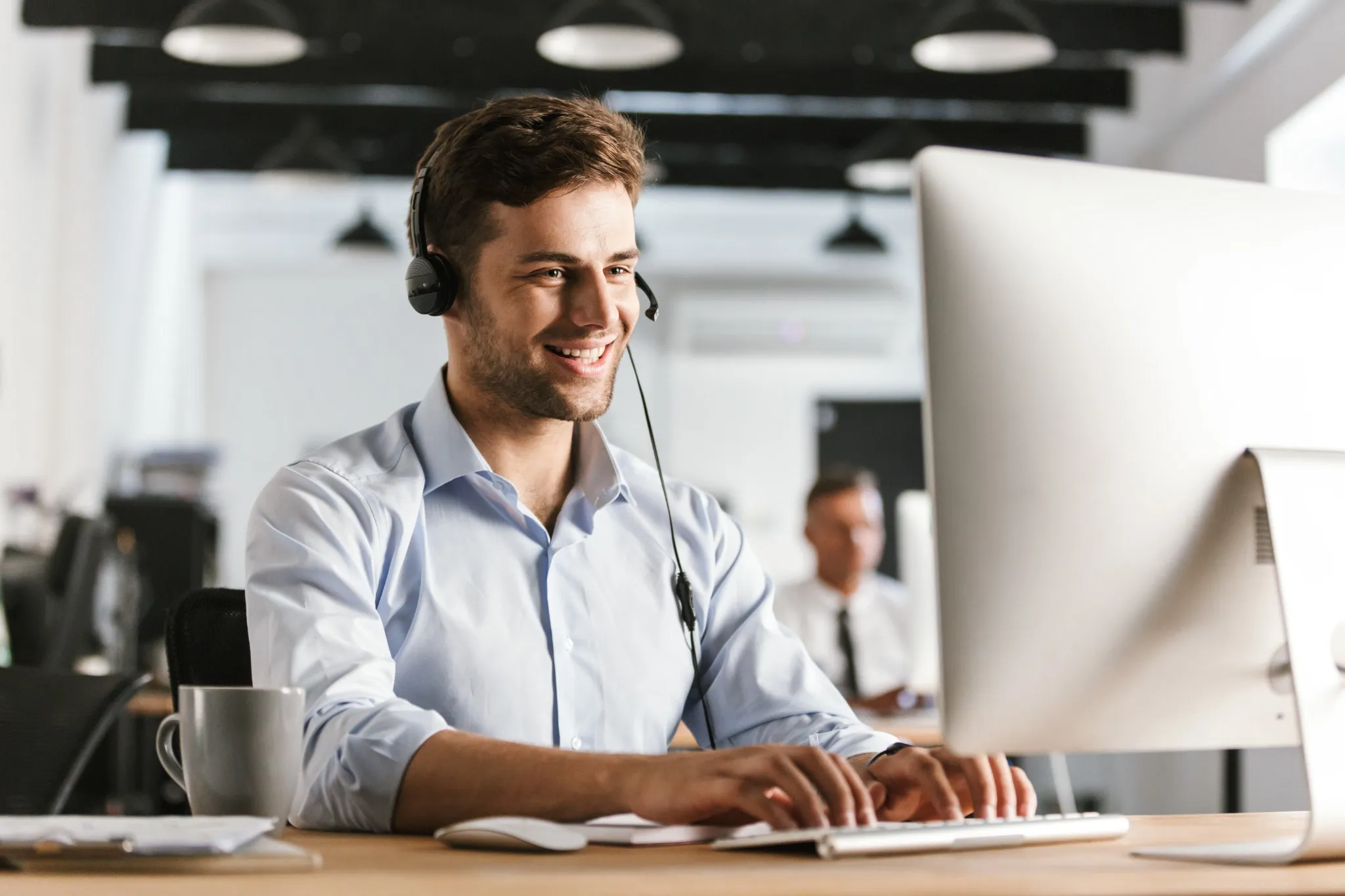 Man in call center with headset