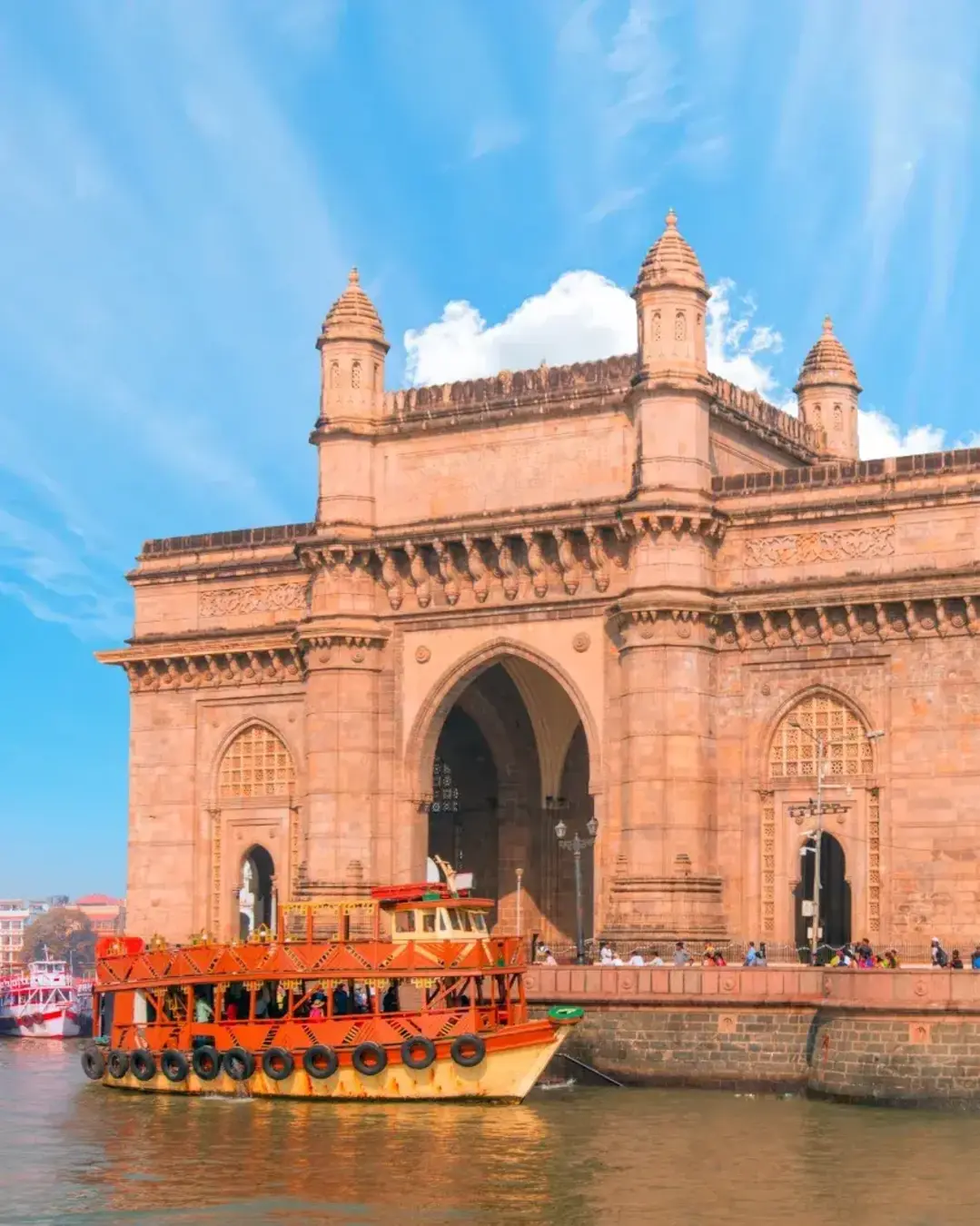 The Gateway of India and boats as seen from the Harbour - Mumbai, India.