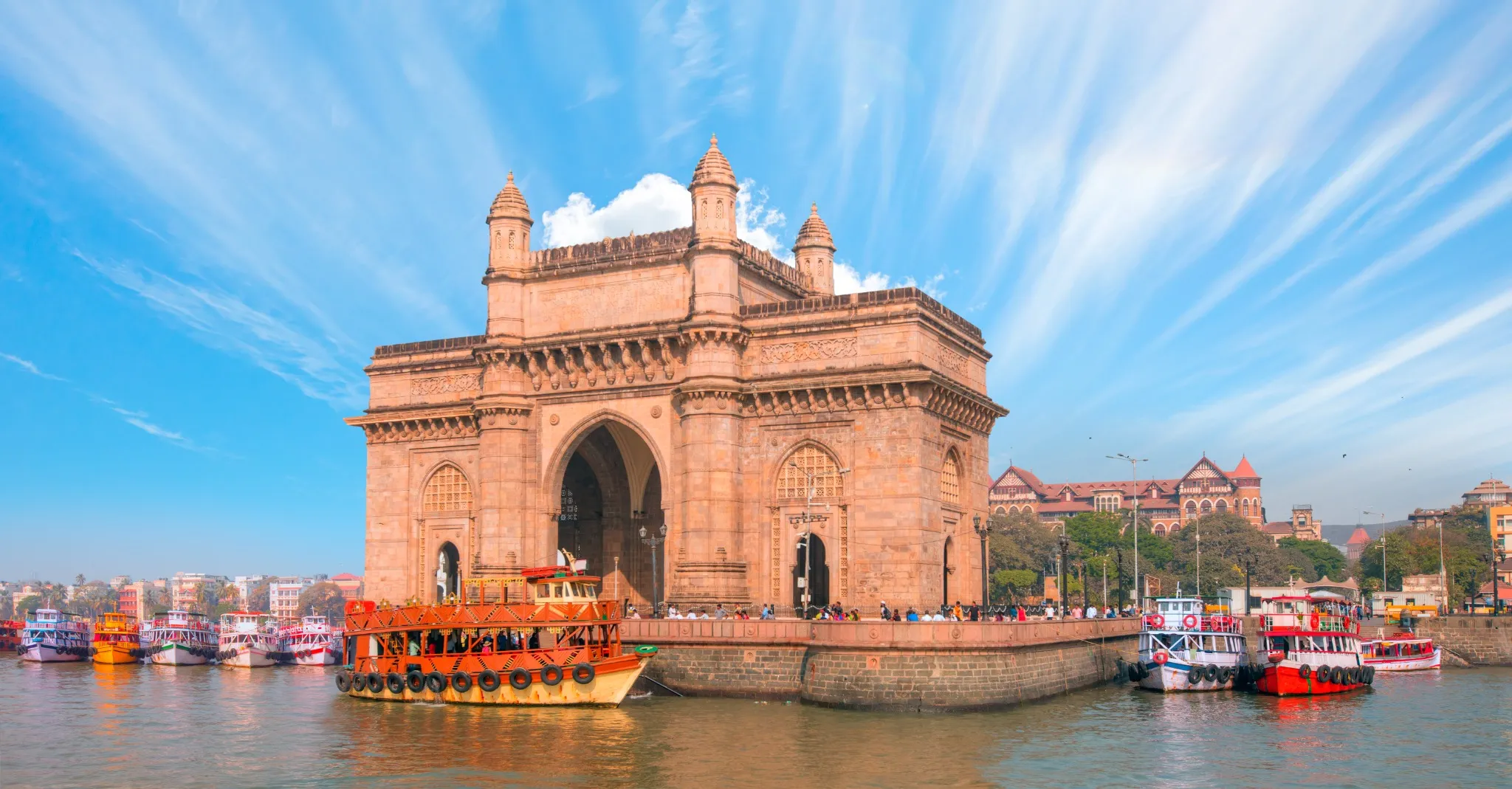 The Gateway of India and boats as seen from the Harbour - Mumbai, India.