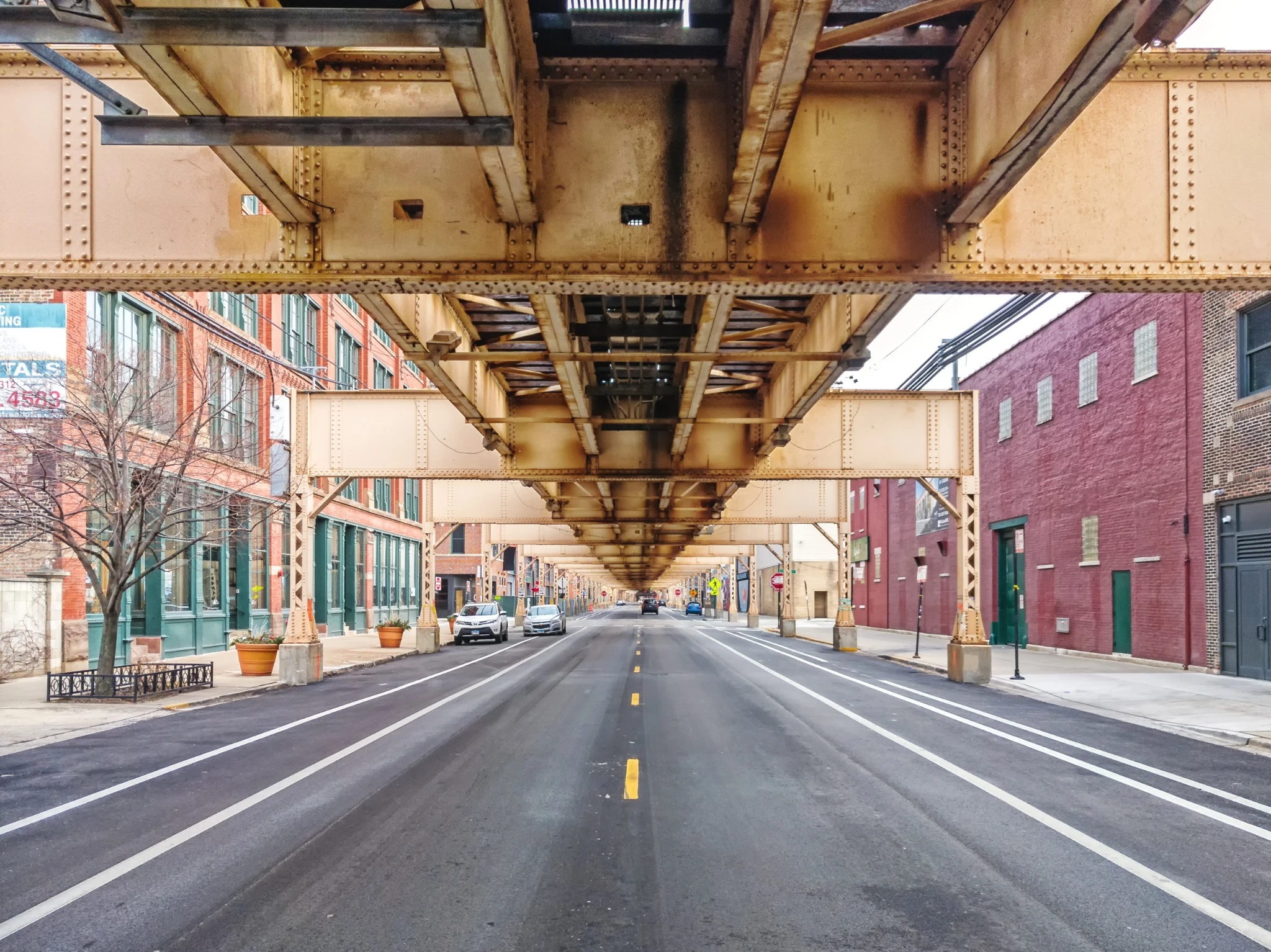 Lake Street underneath the elevated train in the Fulton Market neighborhood, east perspective. Main streets in Chicago, streets in Illinois.