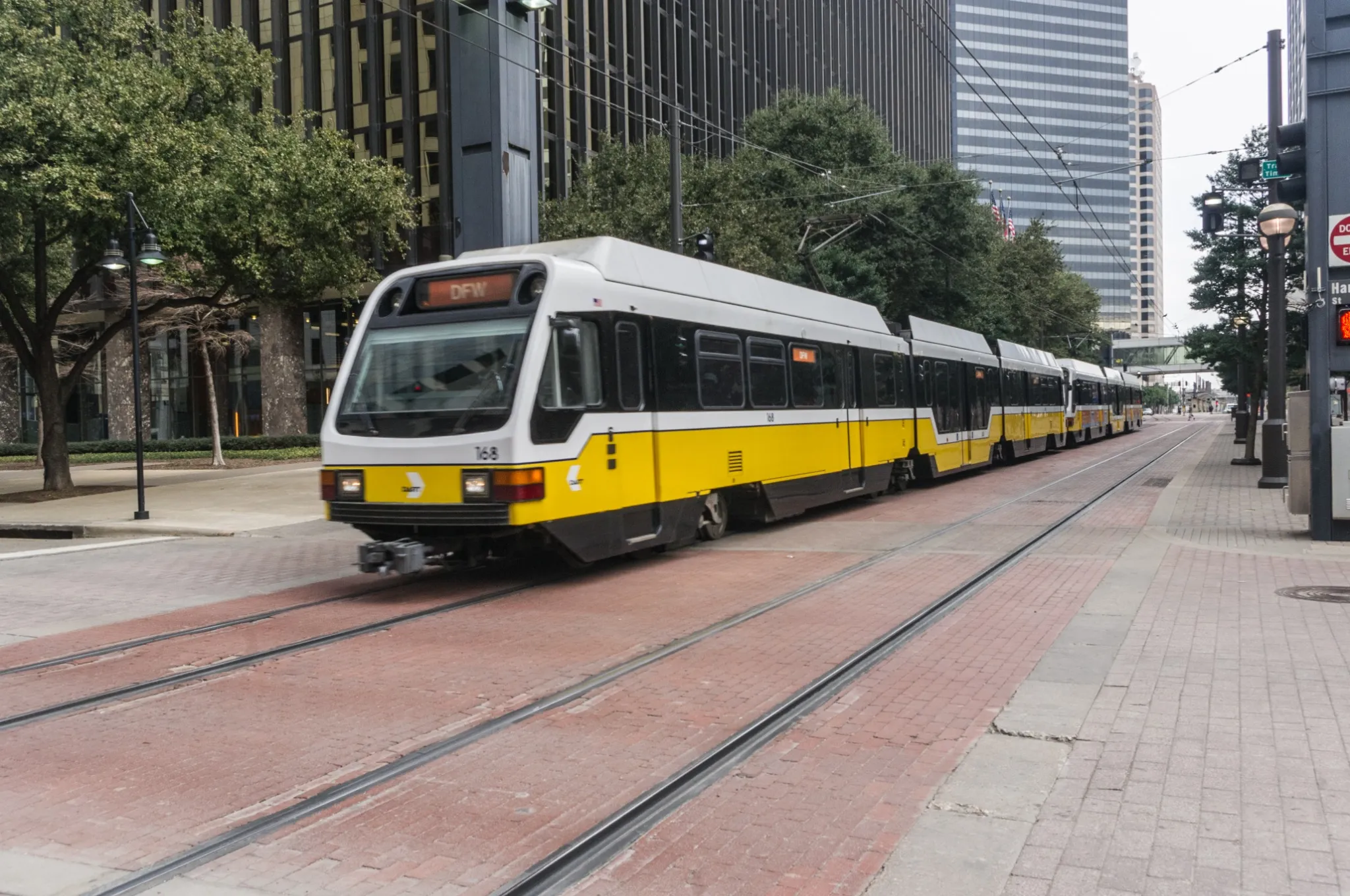 Train traveling through downtown Dallas