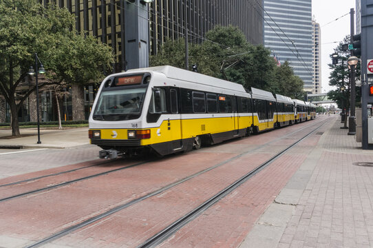 Train traveling through downtown Dallas