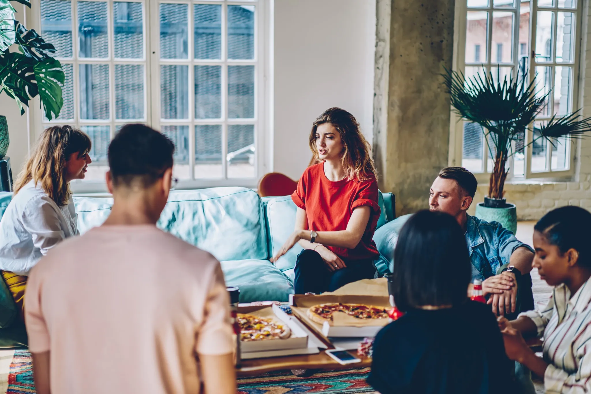 young people chatting in community lounge area