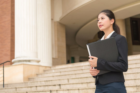 Smiling Lawyer with case files