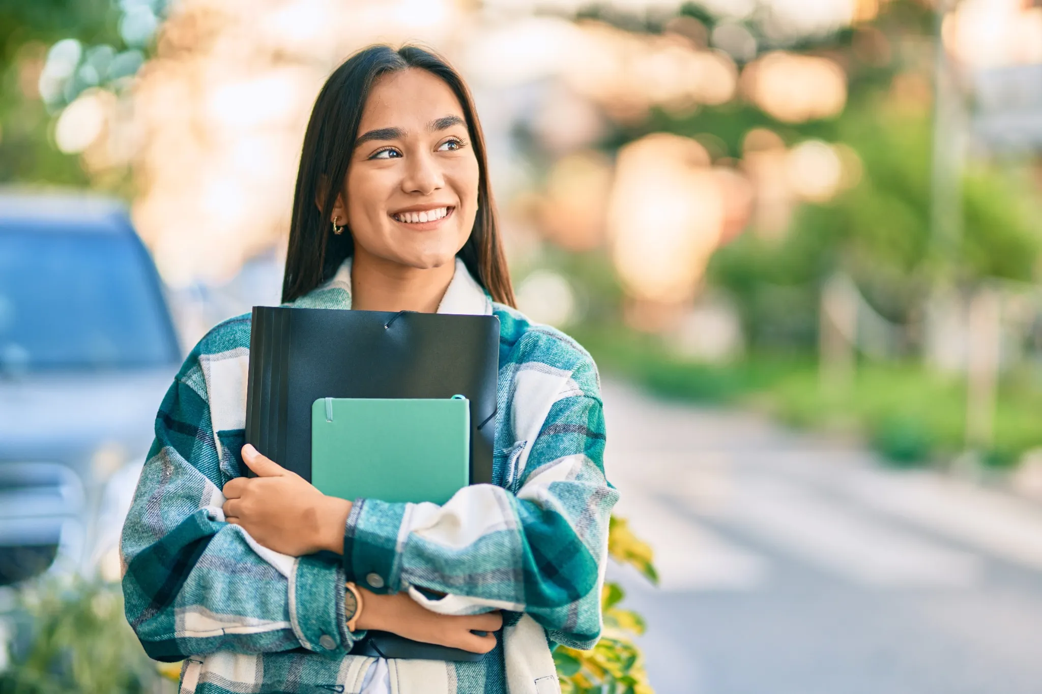 Young woman holding books