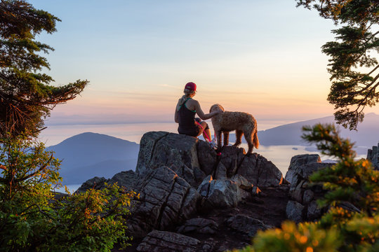 Woman on a beautiful hike with her dog