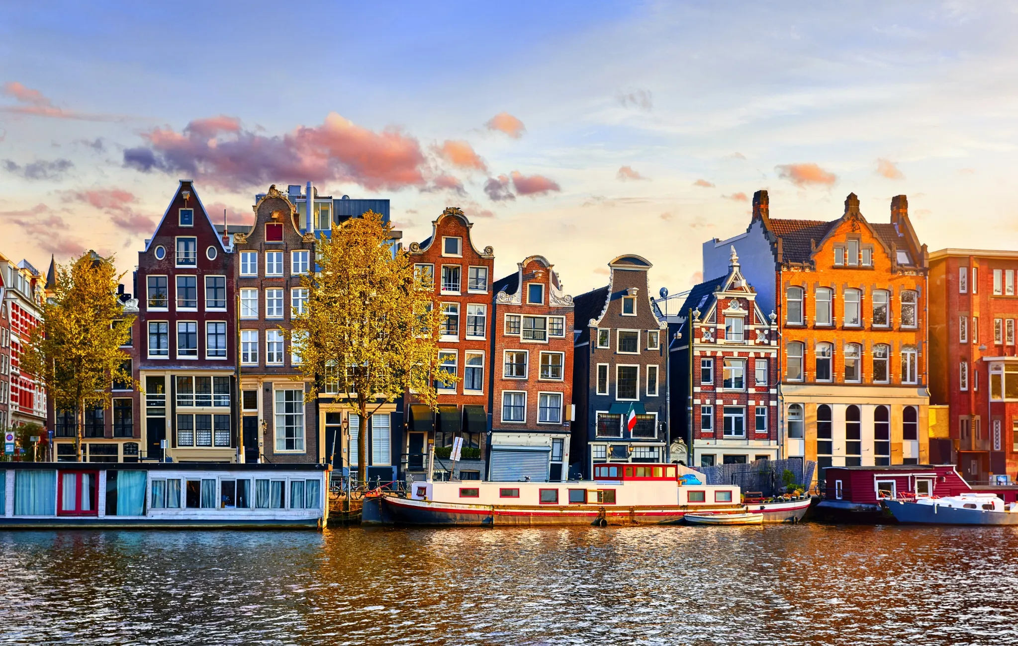 Amsterdam Netherlands dancing houses over river Amstel landmark in old european city spring landscape.