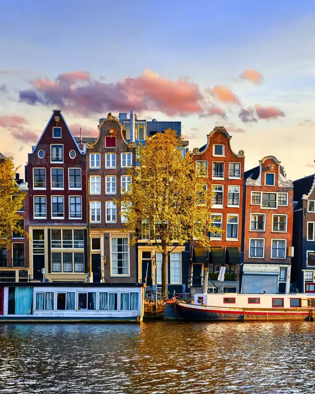 Amsterdam Netherlands dancing houses over river Amstel landmark in old european city spring landscape.