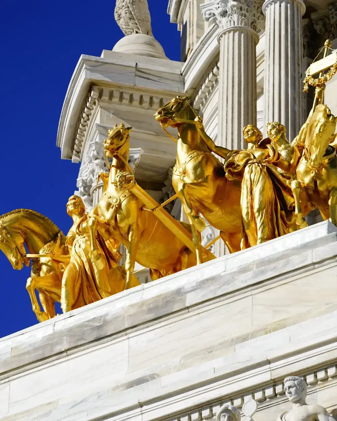 The Quadriga progress of the state. Golden statues to top of Minnesota state Capitol building.