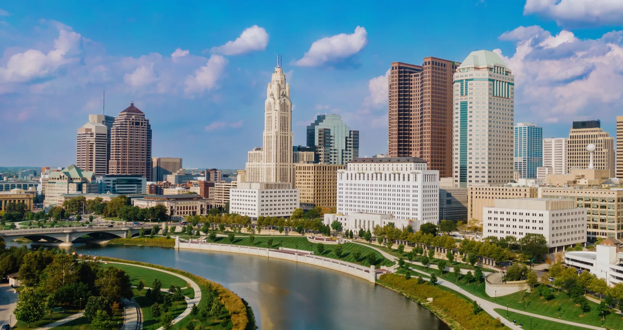 High-angle view of downtown Indianapolis, Indiana, showcasing the city's skyline, including the iconic Indiana Statehouse, and the White River.