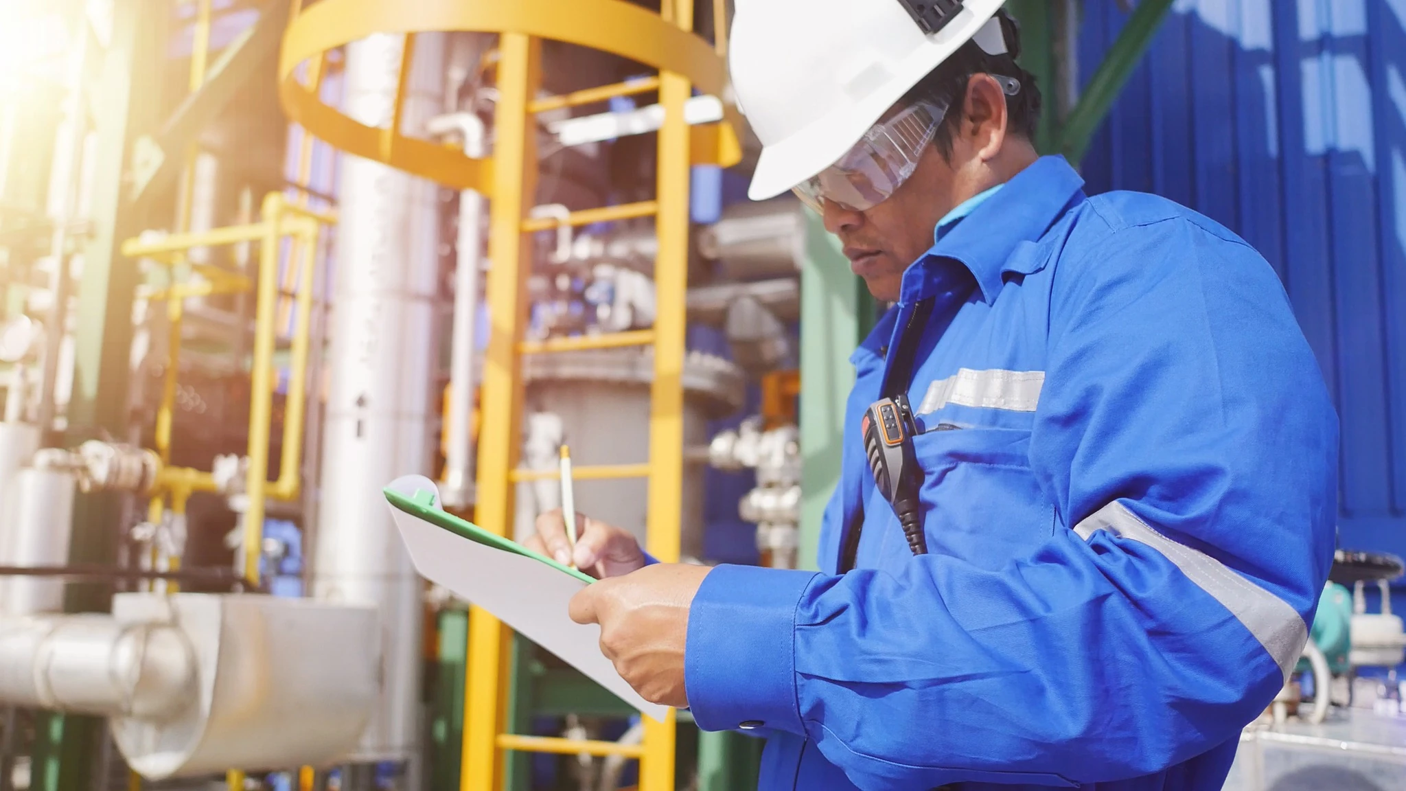 Production engineer to working in petroleum refinery plant to check equipment in factory and record to check sheet.