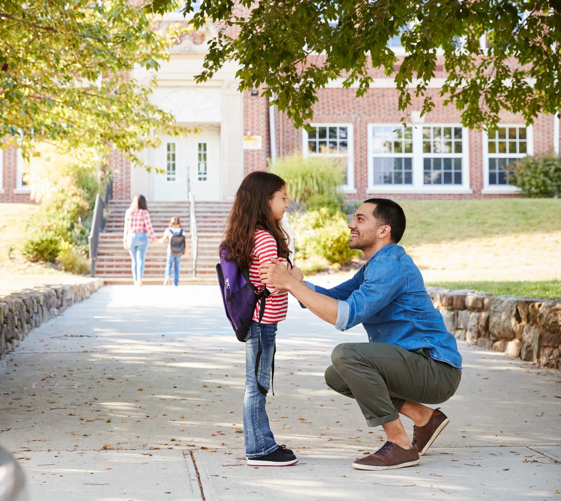 Dad dropping child off at school