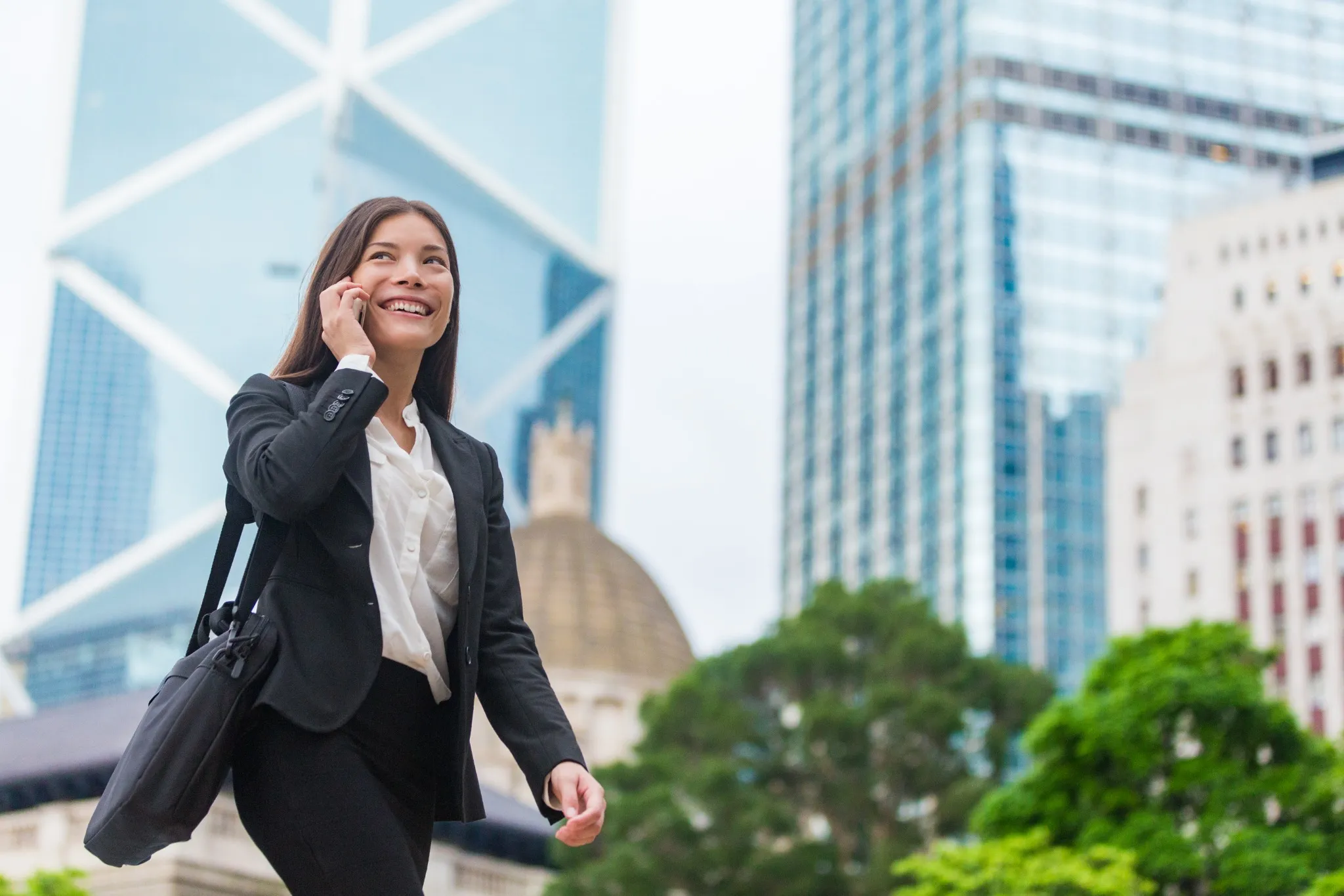 WOman on the phone walking down the street