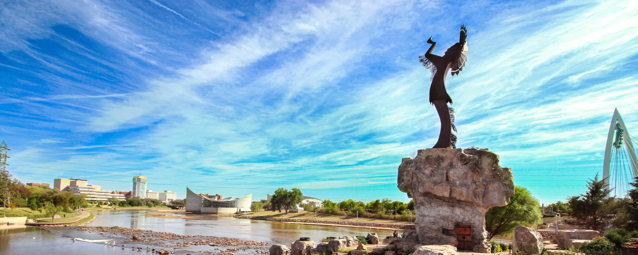 Keeper of the plains Sculpture in dramatic background in Wichita Kansas