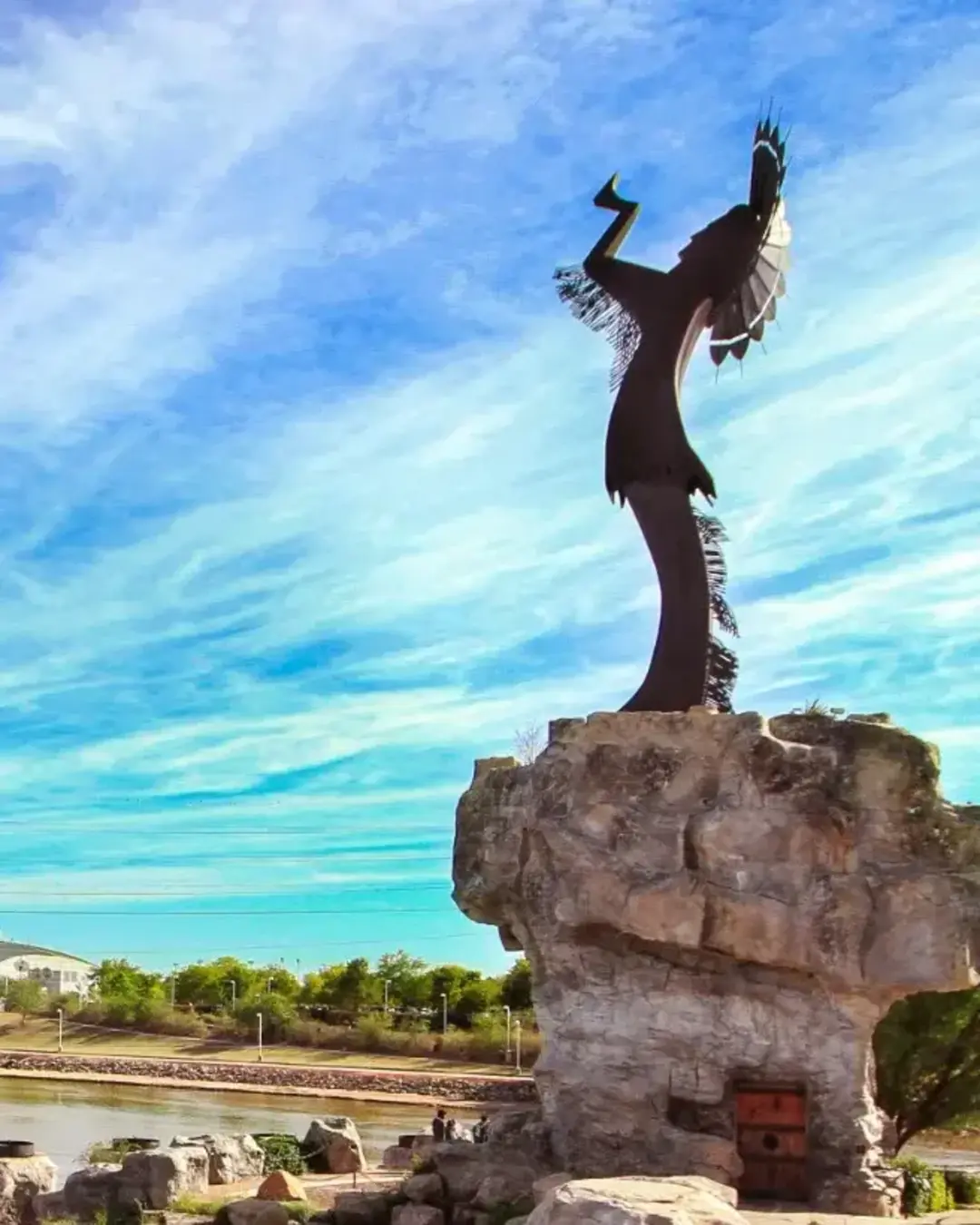 Keeper of the plains Sculpture in dramatic background in Wichita Kansas