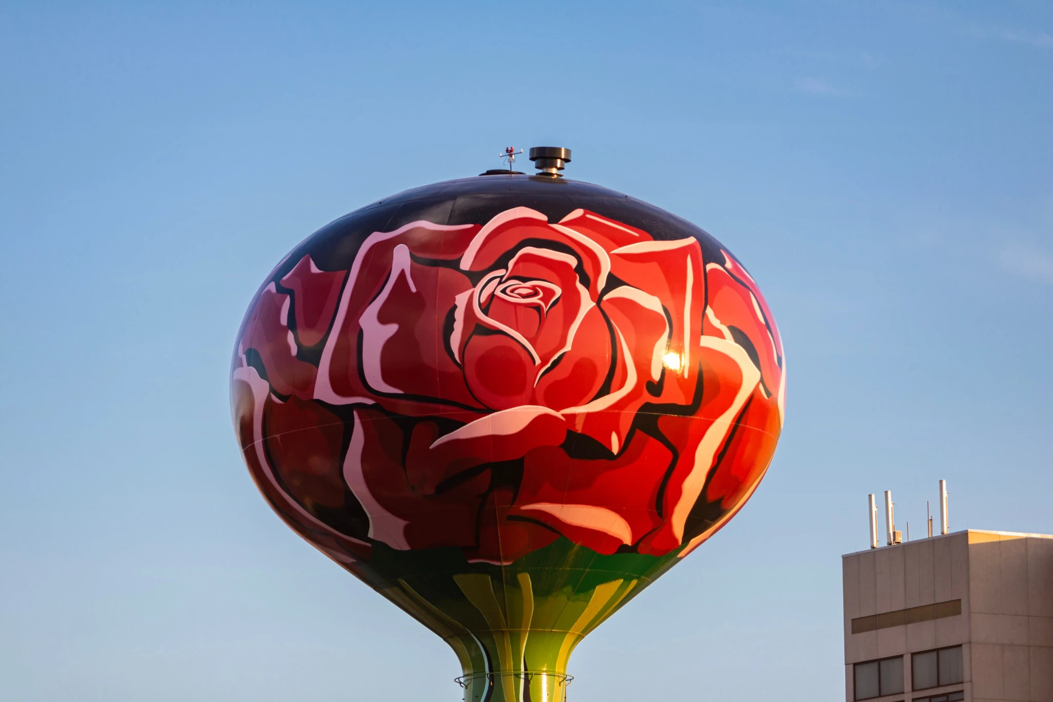 A beautiful red rose flower design on a water tower in Rosemont, Illinois
